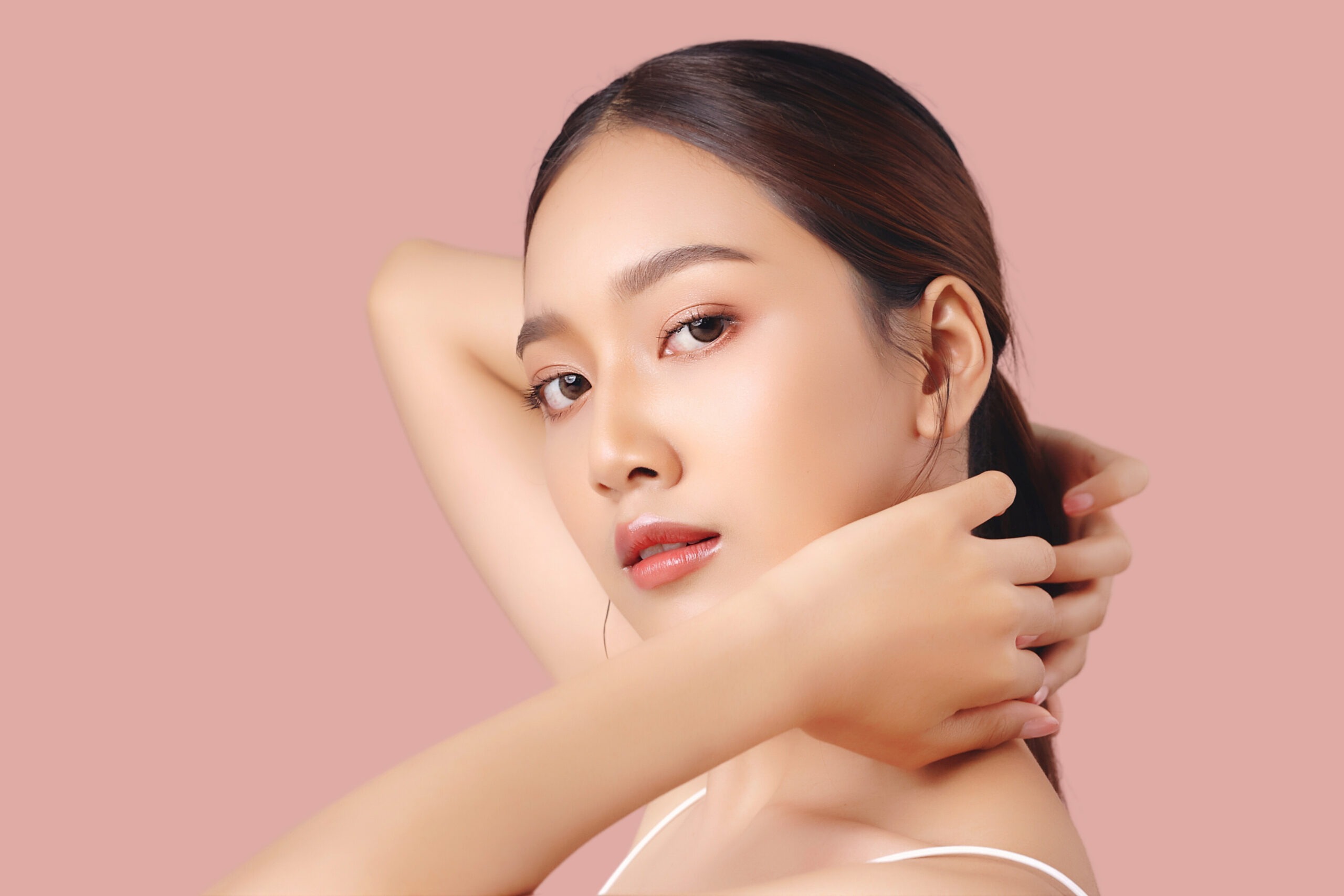 Close up portrait happy young Asian girl with clean and fresh fa young woman with shadows across her face